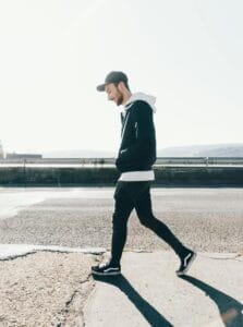 walkingshoesra.com Young man walking outdoors wearing black walking shoes